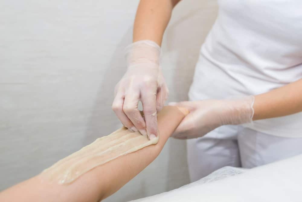 Sugaring paste applied to hair of the ideal length for effective hair removal.