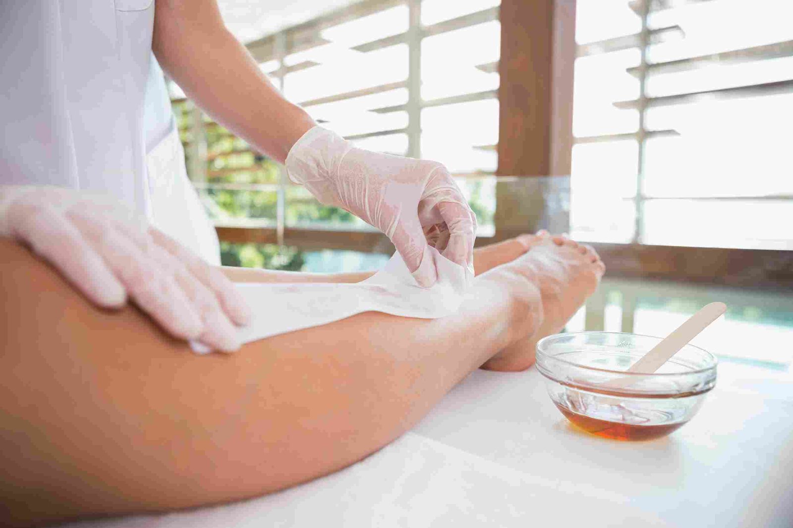 Short hair not providing enough surface area for sugaring paste to adhere, causing patchy removal.