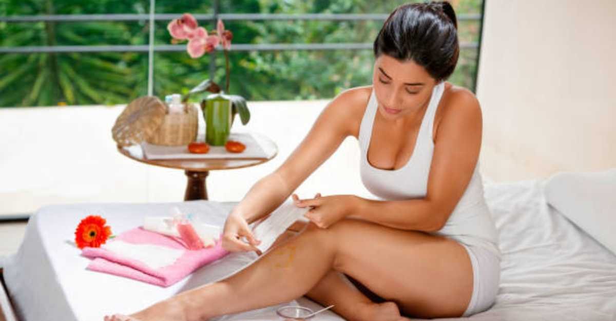 What is a bikini wax? Our aesthetician applies a client's bikini wax on the bed.