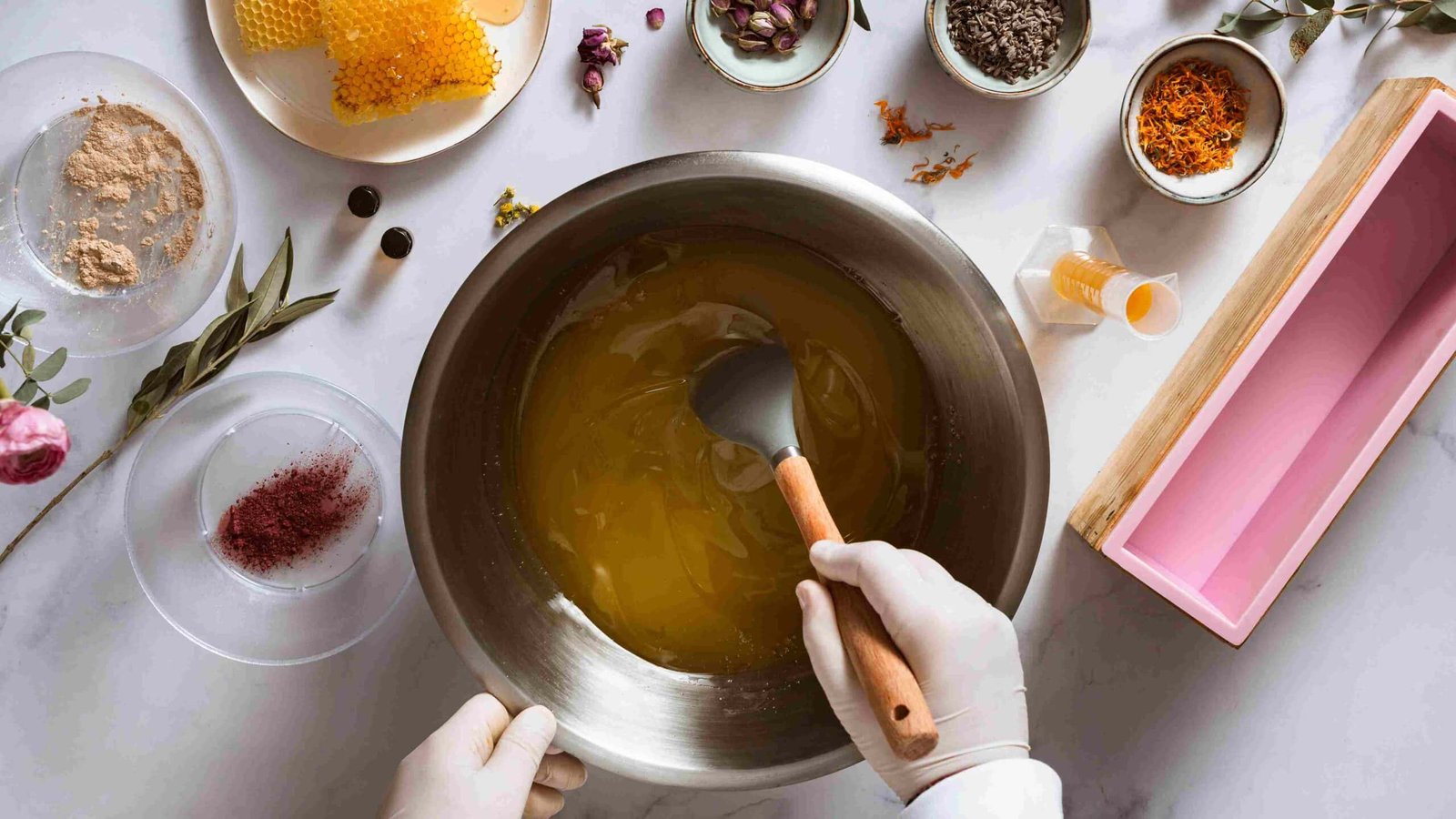 DIY sugar wax recipe preparation on the stove with sugar, lemon juice, and water.