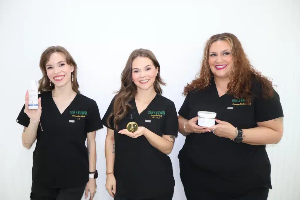 Sugar & Wax Haven Team Showing Skincare Products